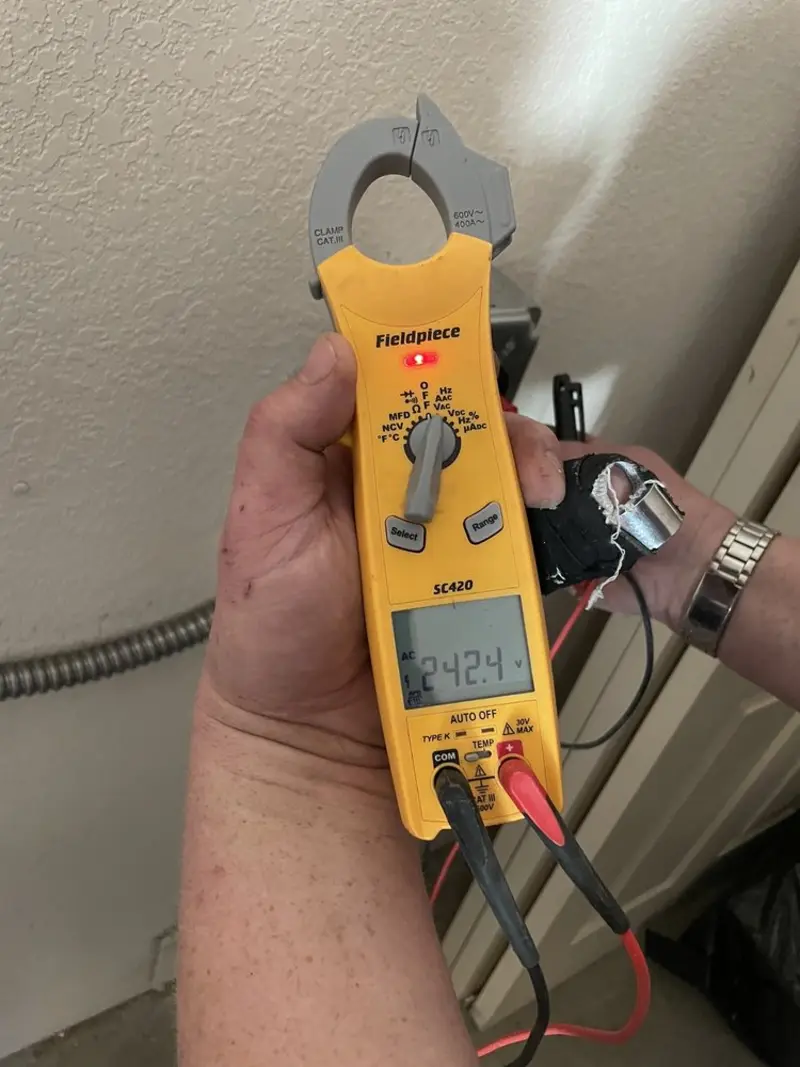 Voltage testing with clamp meter during Electrical Installation Services in Friendship Heights Village